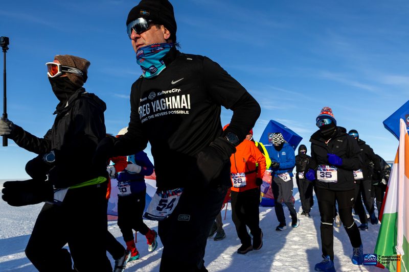 Running in a pack of competitors during a night leg of the challenge